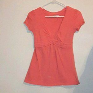 coral v-neck top.